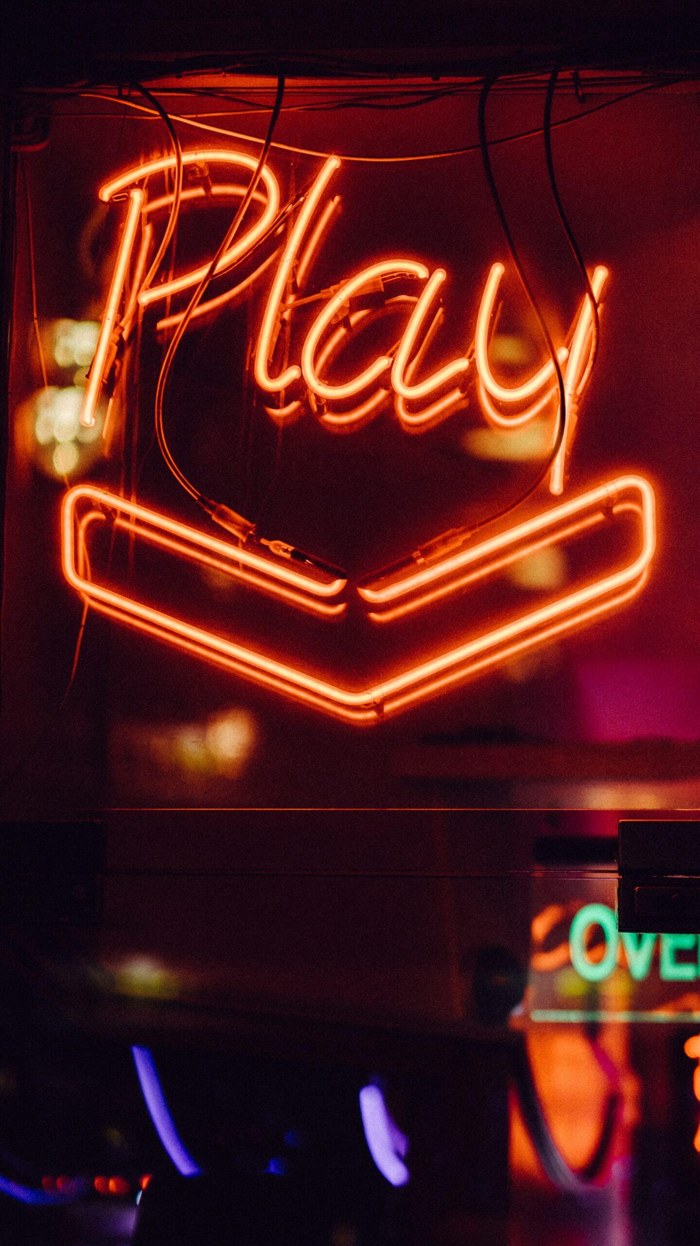 Neon sign lit up with the word Play. Photo by Clem Onojeghuo on Unsplash