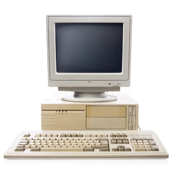 an old beige-coloured PC with keyboard